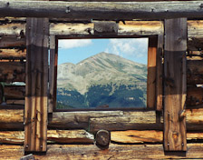 Jacque Peak through a cabin window